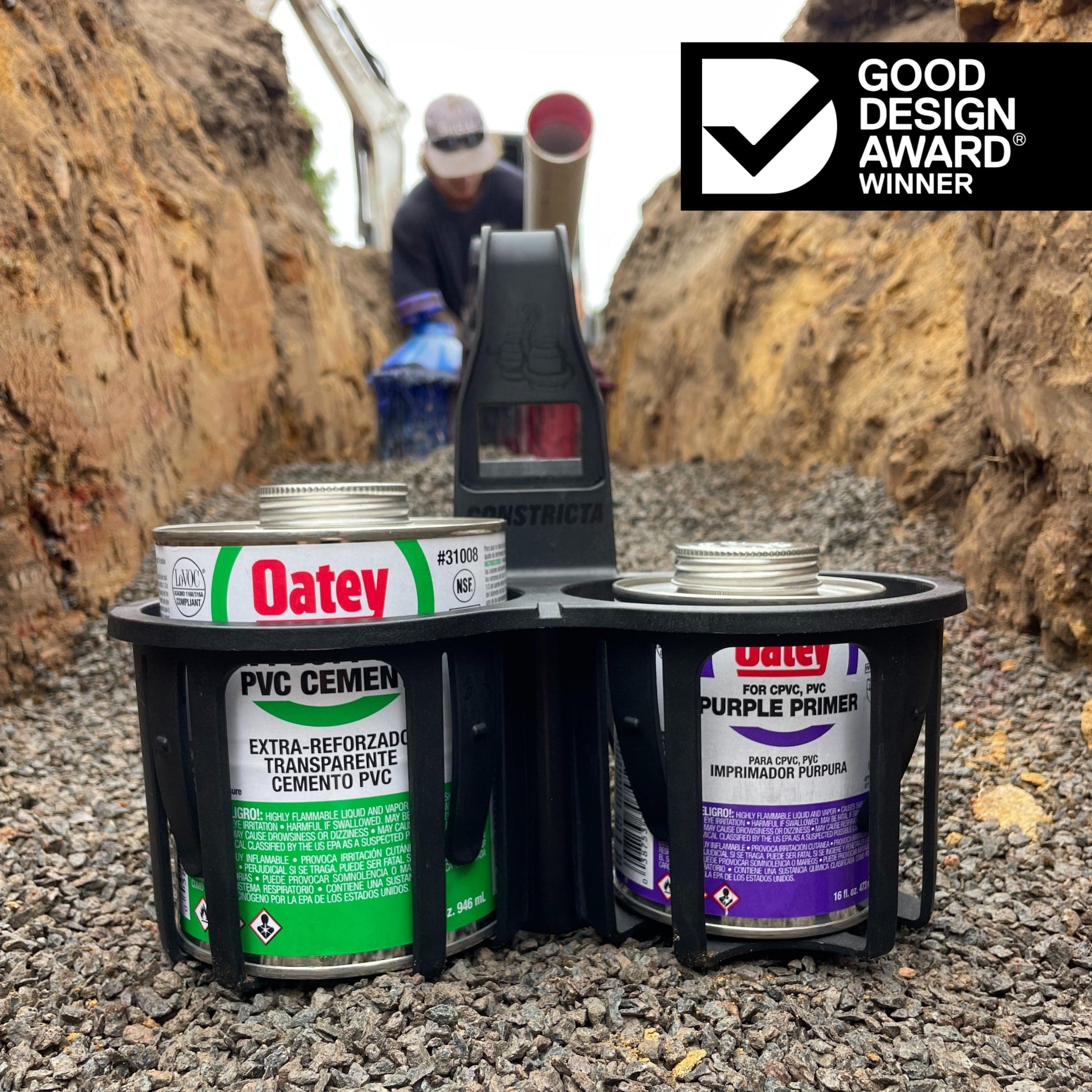 Black Constricta Multi Pot Grip holding PVC glue and primer tins securely.