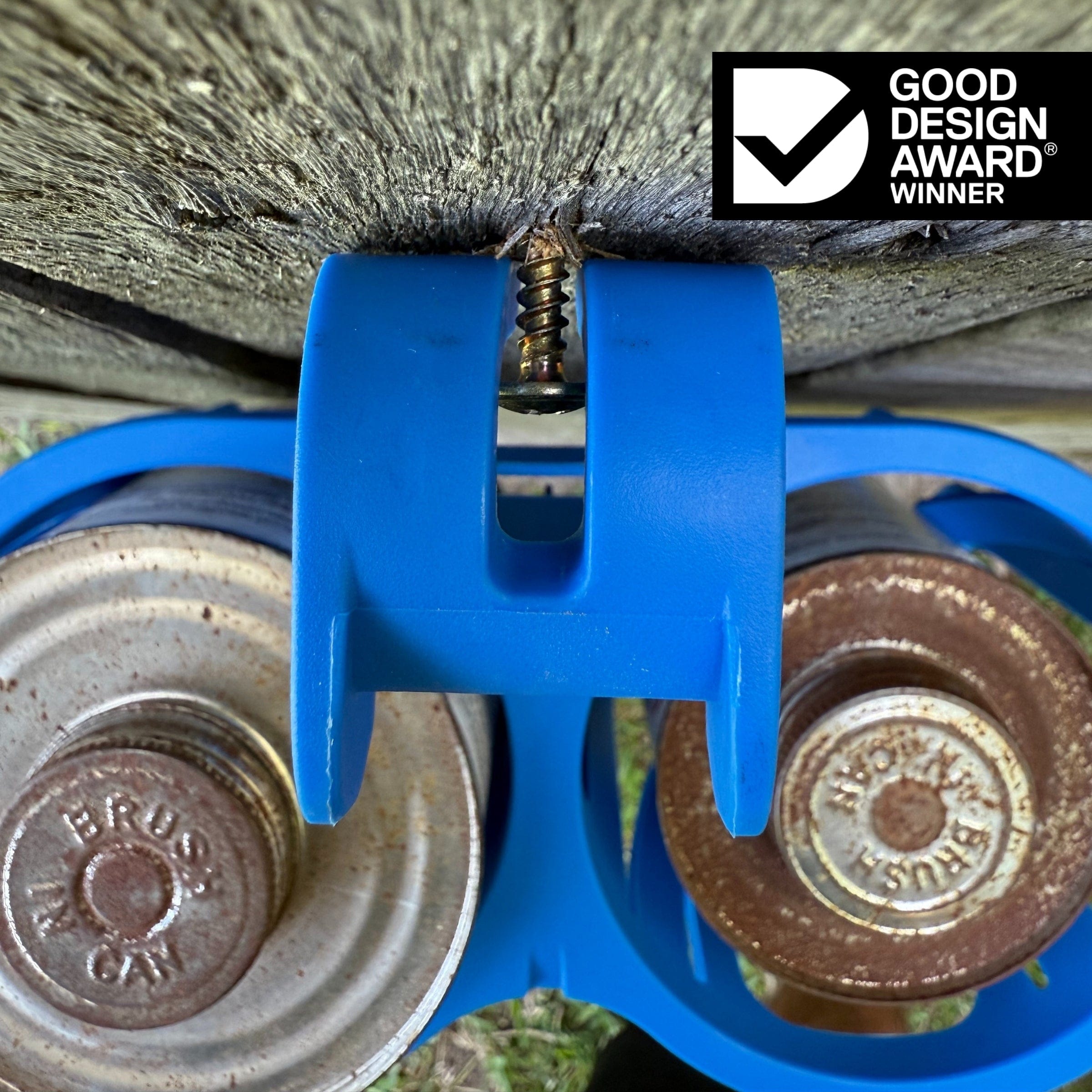 Blue constricta multi pot grip hanging from a screw to show off its fastening channel 