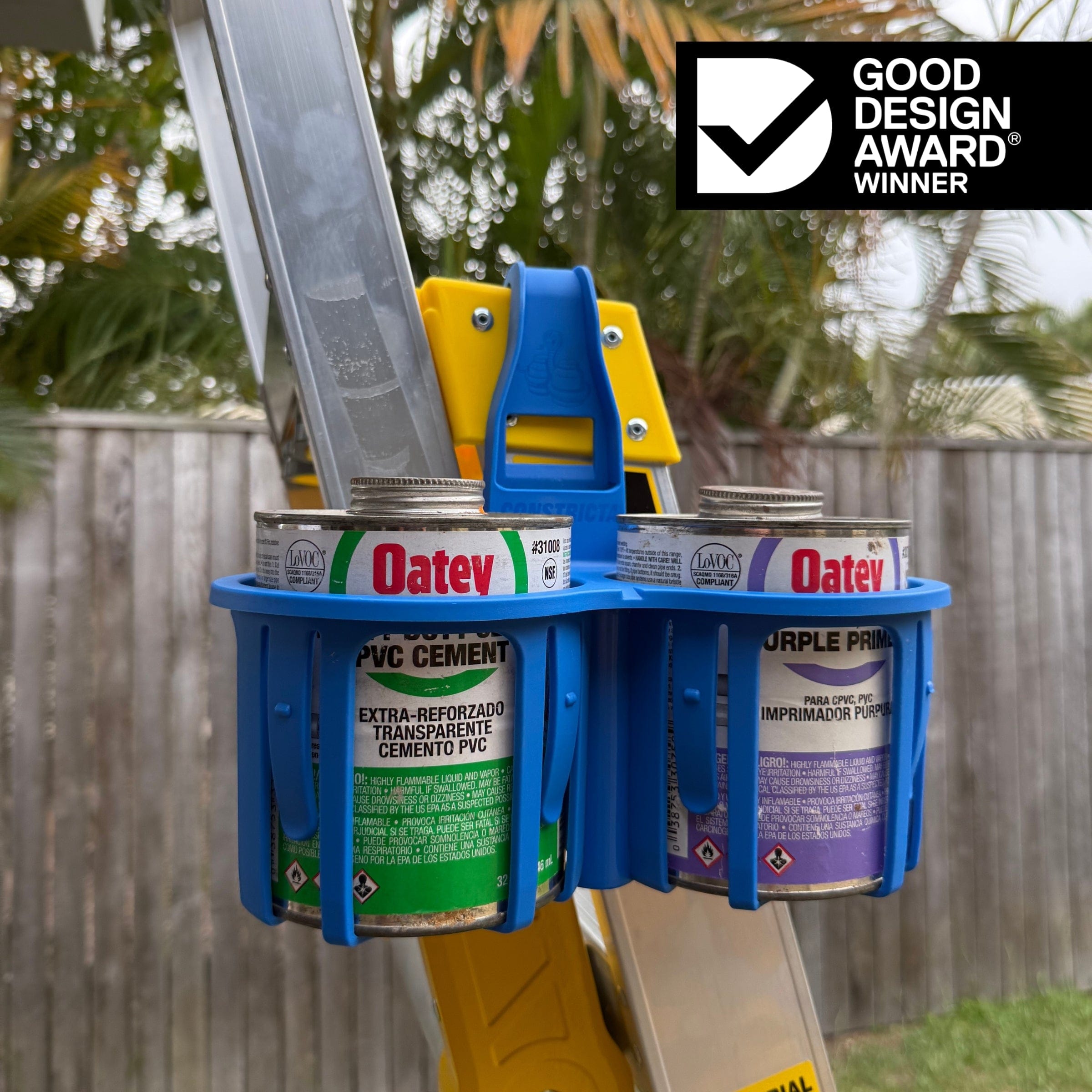 Blue constricta multi pot grip - hanging on a ladder - the open design of the constricta multi pot grip means all safety labels stay visible 