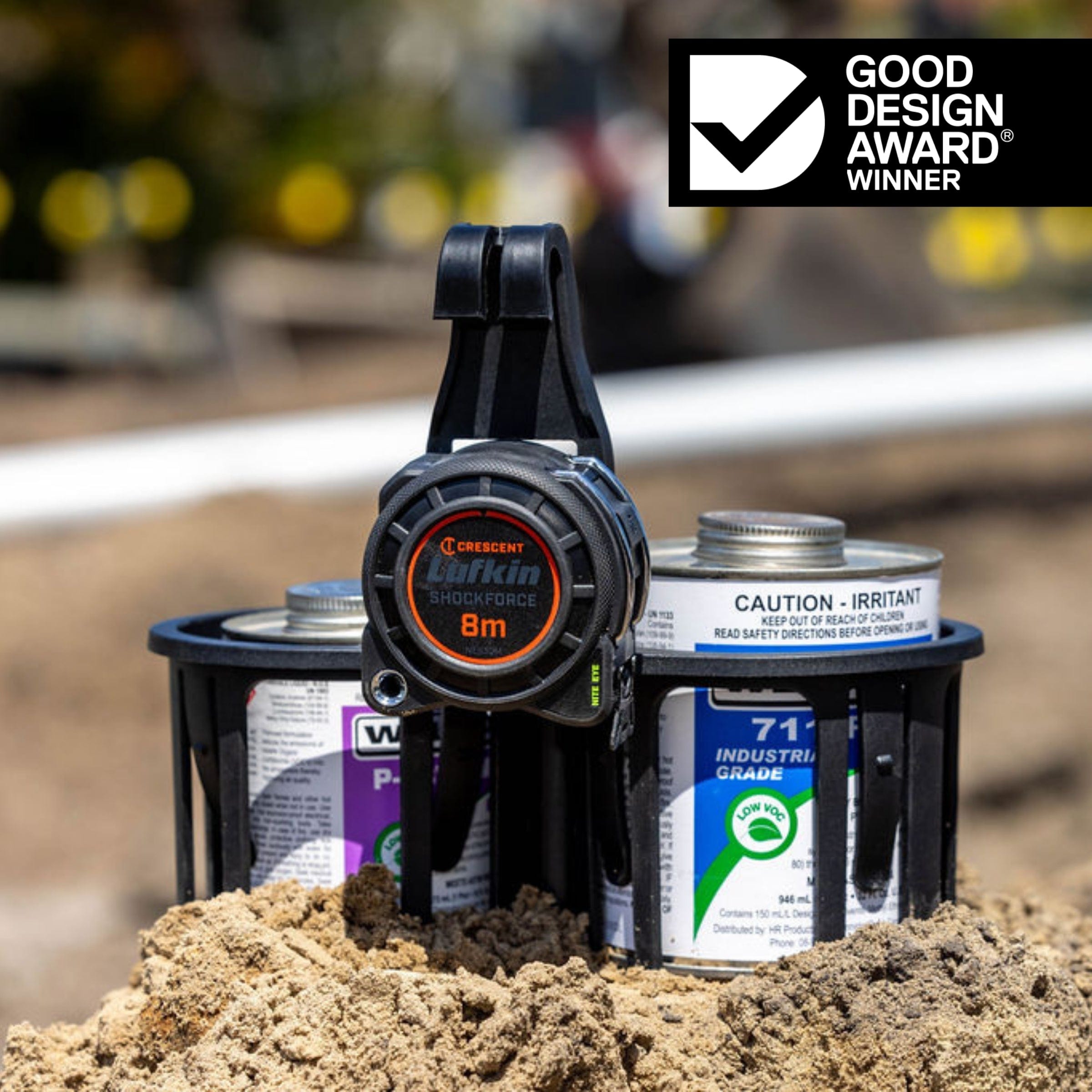 Black constricta multi pot grip - glue and primer caddy with a tape measure on the back